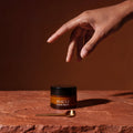 Mauli Rituals Sleep Dharma Calm Balm – jar on stone with a gold spoon
