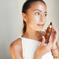 Mauli Rituals Supreme Skin Face Serum 30ml – model holding the serum